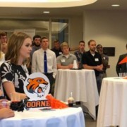 a candid shot in a Doane event, staff members standing at tables